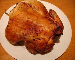 Курица в фольге на углях целиком