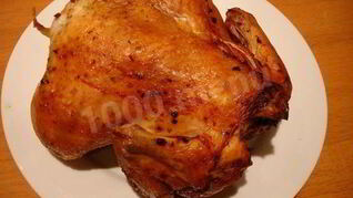 Курица в фольге на углях целиком